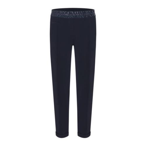 Marineblå bukser med elastisk linning og oppbrettet kant