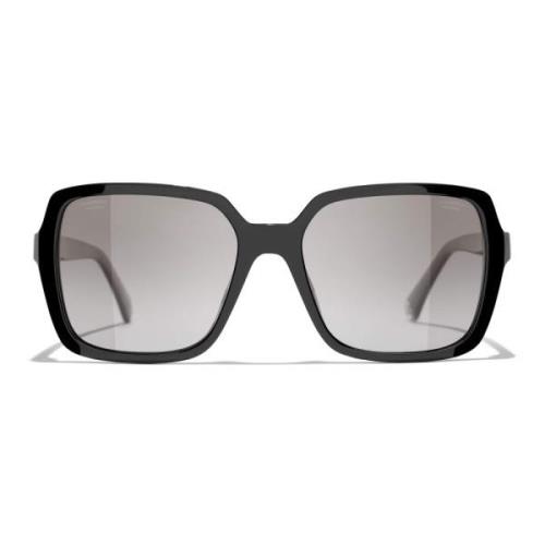 Svarte solbriller med originale tilbehør