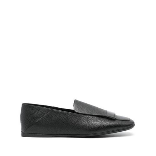 Svarte skinn slip-on sko